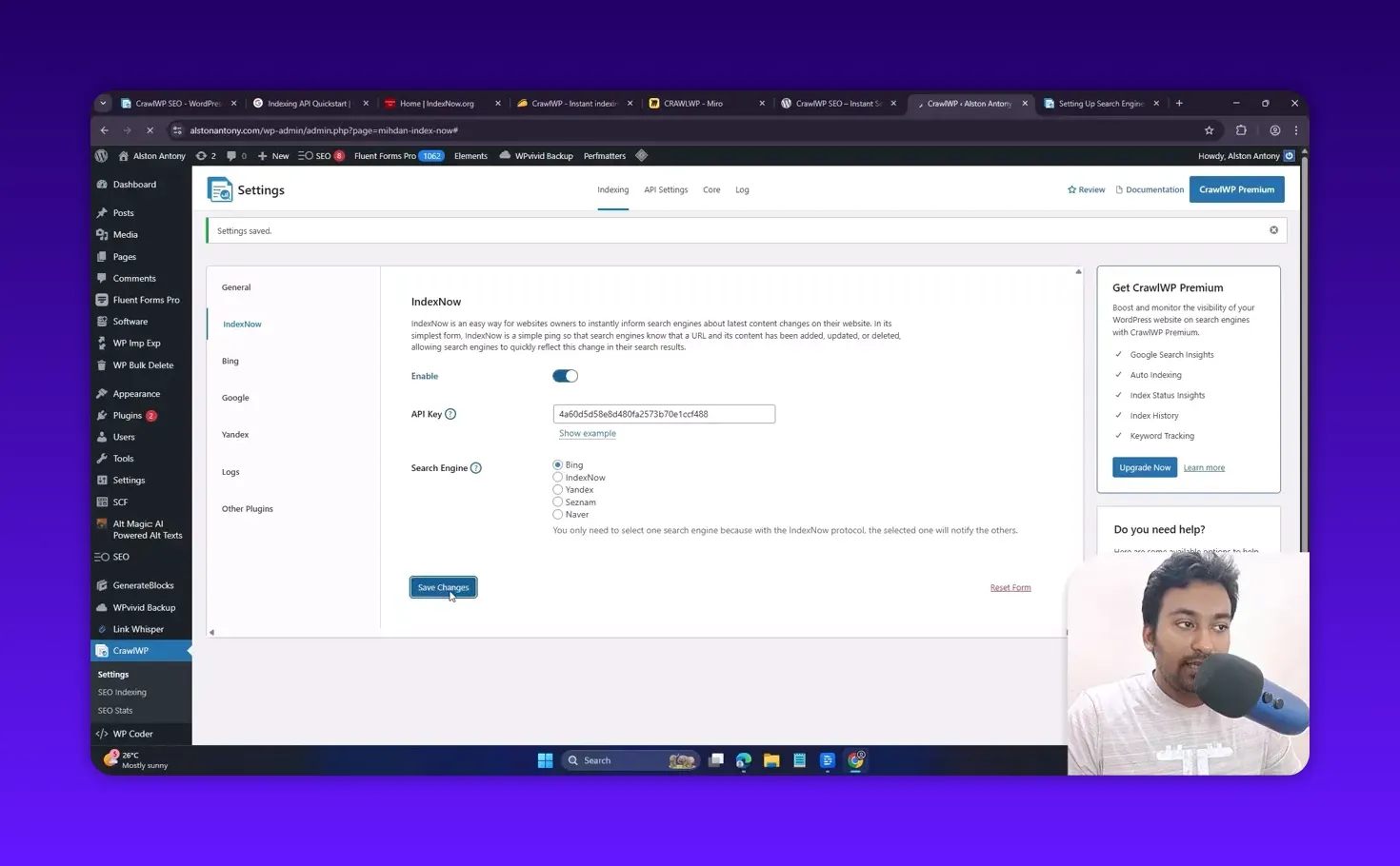 CrawlWP IndexNow settings screen with API Key entered and cursor clicking the 'Save Changes' button.