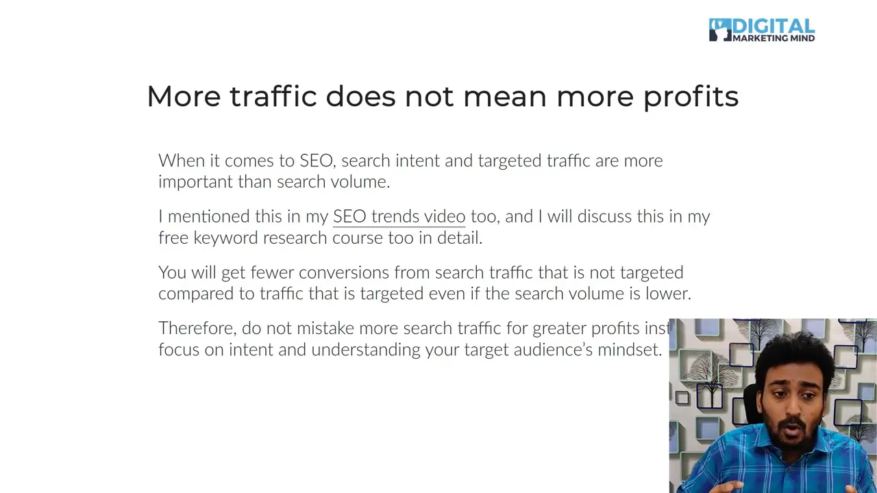 Presentation slide reading 'More traffic does not mean more profits' with explanatory bullet text and a small presenter inset in the lower-right.